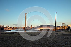 Glasgow Science Centre Tower and downtown lit by the setting sun