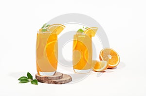 Glass of 100% Orange juice with orange slices fruits isolated on white background. cooling beverage summer drink