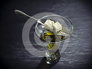 Glass of Absinthe with traditional spoon