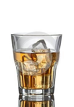 glass of alcohol and cube ice on white background