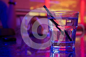 Glass of alcohol drink in the night club photo