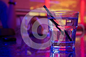 Glass of alcohol drink in the night club