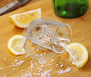 Glass of alcohol and lemon