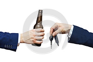 Glass of alcoholic beverage in man hand and car key in man hand. Do not drink and drive! Drunk driving. Drink and auto keys