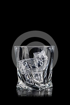 Glass for alcoholic drinks with cun ice on black