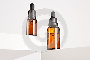Dropper containers with pipettes on white background. photo