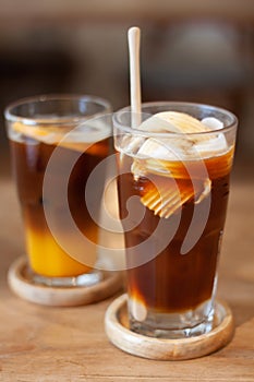 Glass of americano mixed with coconut