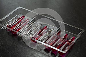 Glass ampoules with vitamins B1, B6 and B12 in a plastic tray