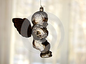 Glass Angel in front of Window