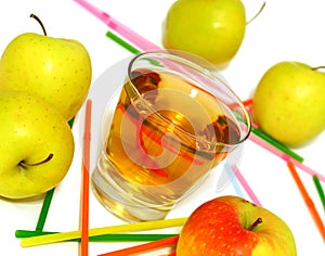 glass of apple juice and fresh apples on white