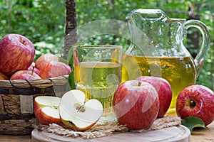 Glass of Apple Juice and Fresh Red Apples