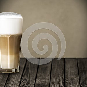 Glass of aromatic macchiato Italian coffee