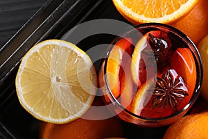 Glass of aromatic punch drink and fresh fruits on table, flat lay