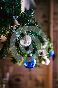 glass ball and decorations on Christmas tree ,Christmas tree garland with blue and silver balls, close-up. Perspective, blur