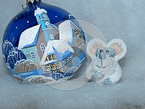 Glass ball and symbol of the New Year 2020 is a white rat mouse according to the eastern calendar. New Year`s toys.