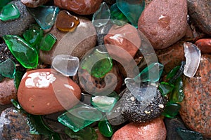 Glass beach. Natural texture with polished sea glass, stones and sand. baltic sea