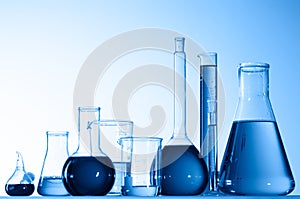 Glass beakers with blue liquid photo