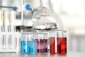Glass beakers with liquid samples. Laboratory analysis