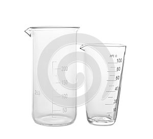 Glass beakers on white background