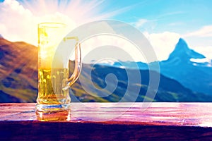 A glass of beer against the backdrop of the Matterhorn in the Swiss Alps rest, relaxation, anti-stress - concept