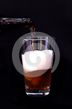 Glass of beer and bottle