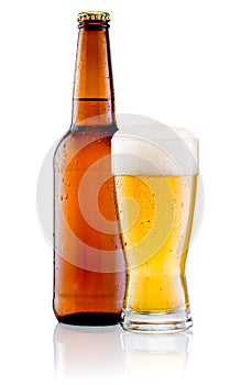 Glass of beer and Brown bottle with drops isolated