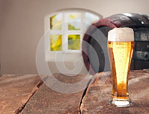 Glass of beer and a cask photo