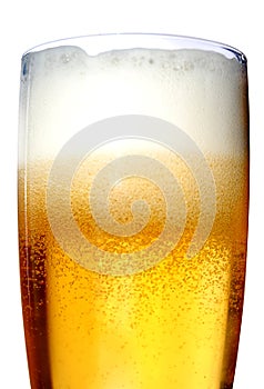 Glass of beer close-up with froth photo
