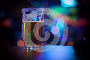 Glass of beer with colorful background
