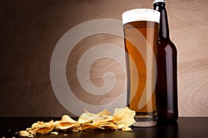 Glass with beer and crisps