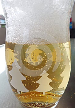 Glass with beer and foam, close up