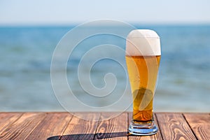 Glass of beer with froth and bubbles