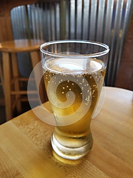 Glass of Beer on Pub Table