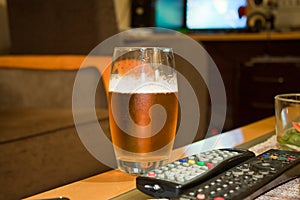 Glass of Beer with remote in the Living room