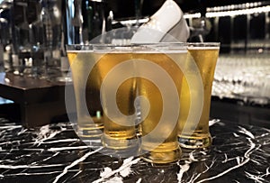 Glass of beer served on the counter in a party