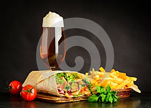 Glass Beer with Shawarma Sandwich and Fries