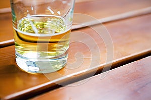 Glass of beer on table