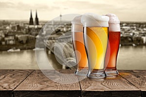 Glass of beer with view of Koeln on background