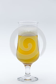 Glass of beer on white background