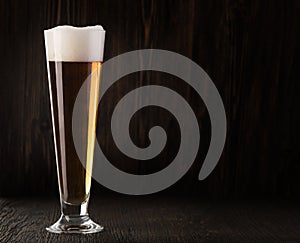 Glass beer on wood background