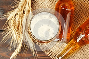 Glass beer on wood background. Close up.