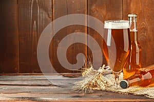 Glass beer on wood background. Close up.