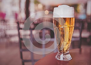 Glass of beer on a wood table