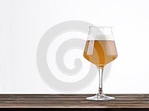 Glass of beer on a wood table isolated on white background