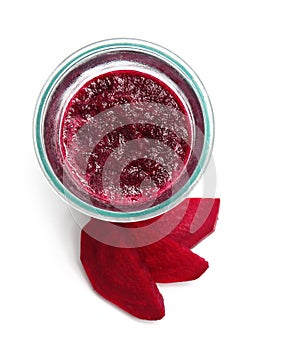 Glass of beet smoothie on white background