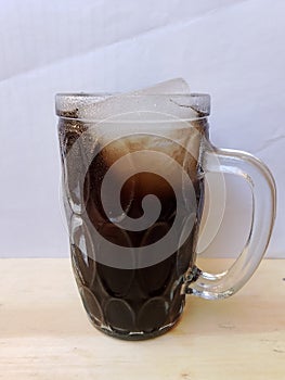 A glass black cincau ice help quench thirst, cincau made from the grass jelly in Indonesia