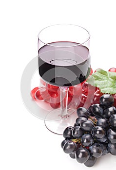 Glass of black wine and grapes