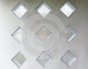 Glass block design on cement wall