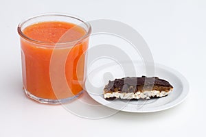 Glass of blood orange and orange juice in glass on white