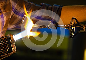 Glass blower making vase